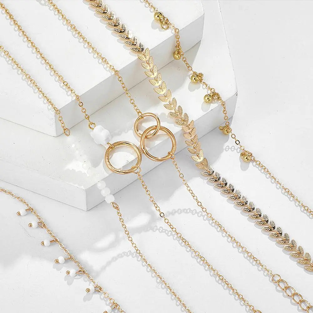 Sett af bóhemískum gullarmböndum